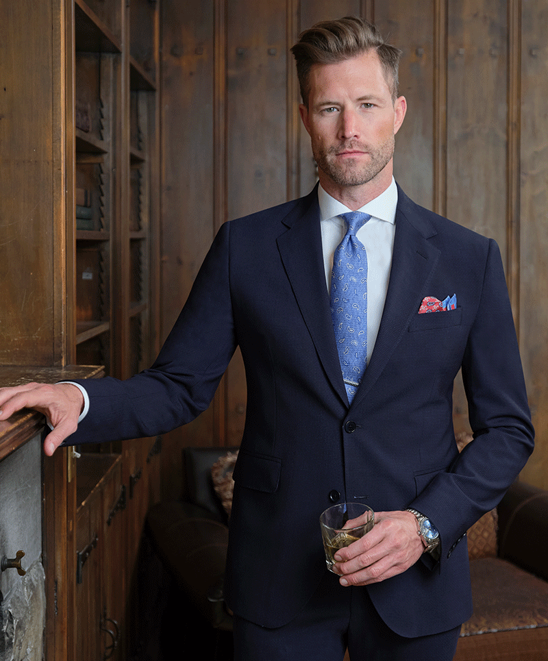 Man wearing Navy Attivo bi-stretch 2 button suit (cloth 27300) with light blue accent.
