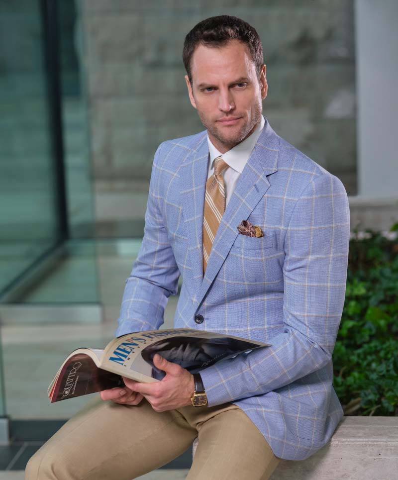 Light blue sport coat with tan window pane (cloth #27967) paired with tan trousers
( cloth #25147).